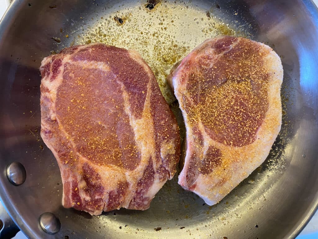 Salt on farm fresh pork chops.